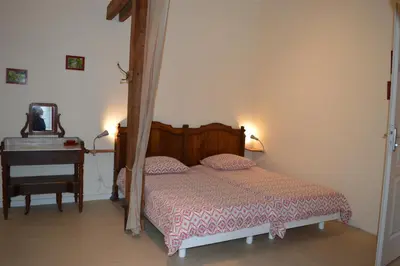 Un ou plusieurs lits dans un hébergement de l'établissement Ma maison de famille, grange du 18e siècle, jardin