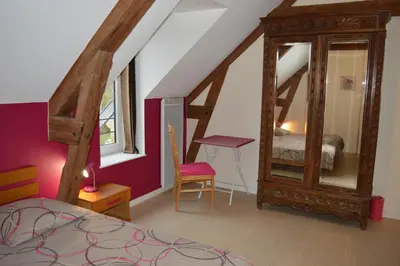 Un ou plusieurs lits dans un hébergement de l'établissement Ma maison de famille, grange du 18e siècle, jardin
