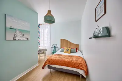 Un ou plusieurs lits dans un hébergement de l'établissement Le Château Rêvé - Superbe appt vue mer