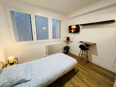 Un ou plusieurs lits dans un hébergement de l'établissement Studio cosy près du centre Nordblue