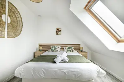 Un ou plusieurs lits dans un hébergement de l'établissement House of Travels - Proche Plage