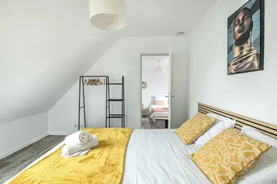 Un ou plusieurs lits dans un hébergement de l'établissement House of Travels - Proche Plage