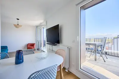 Télévision ou salle de divertissement dans l'établissement Les Embruns de Courseulles - Appt 6personnes