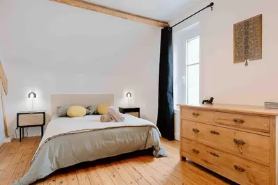 Un ou plusieurs lits dans un hébergement de l'établissement Villa des Genêts