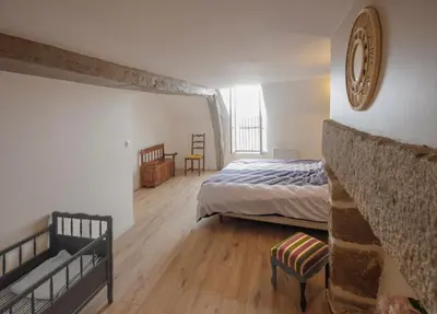 Un ou plusieurs lits dans un hébergement de l'établissement La maison au cœur médiéval
