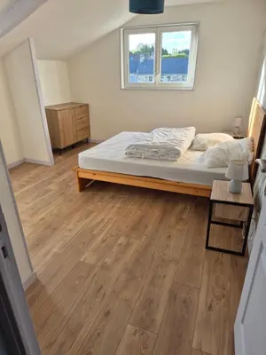 Un ou plusieurs lits dans un hébergement de l'établissement Maison 3 chambres