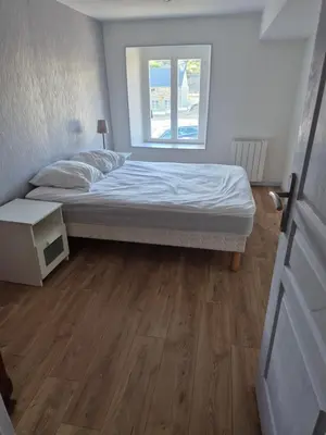 Un ou plusieurs lits dans un hébergement de l'établissement Maison 3 chambres