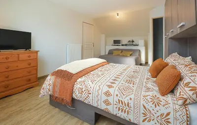 Un ou plusieurs lits dans un hébergement de l'établissement Maison Spacieuse Littoral