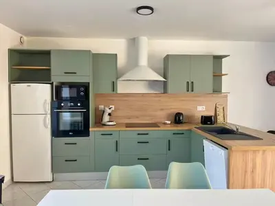 Cuisine ou kitchenette dans l'établissement Maison Centre Ville - Saint-James
