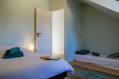 Un ou plusieurs lits dans un hébergement de l'établissement Bel appartement centre de Cancale