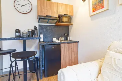 Cuisine ou kitchenette dans l'établissement Le Saint Sauveur - Plein centre de Caen