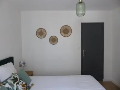 Un ou plusieurs lits dans un hébergement de l'établissement Appartement cozy