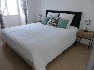 Un ou plusieurs lits dans un hébergement de l'établissement Appartement cozy
