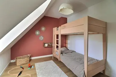 Un ou plusieurs lits dans un hébergement de l'établissement F3 2 chambres duplex Cabourg calme, balcon, proche plage