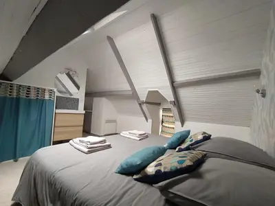 Un ou plusieurs lits dans un hébergement de l'établissement Maison centre Arromanches Acces direct Plage