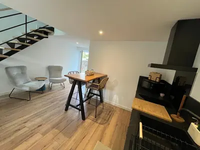 Télévision ou salle de divertissement dans l'établissement La petite maison