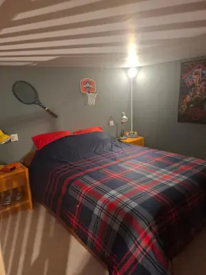 Un ou plusieurs lits dans un hébergement de l'établissement Maisonnette Rétro Loc