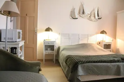 Un ou plusieurs lits dans un hébergement de l'établissement Les Chambres de Catherine