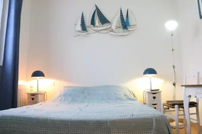 Un ou plusieurs lits dans un hébergement de l'établissement Les Chambres de Catherine