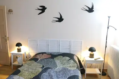 Un ou plusieurs lits dans un hébergement de l'établissement Les Chambres de Catherine