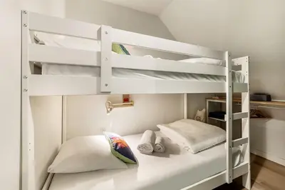 Un ou plusieurs lits dans un hébergement de l'établissement Armor beautiful renovated apartment 2 bedrooms