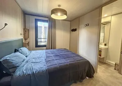 Un ou plusieurs lits dans un hébergement de l'établissement Le Cottage de Laura Jullouville 6 pers