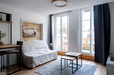 Un ou plusieurs lits dans un hébergement de l'établissement Le charme de la place Saint-Sauveur