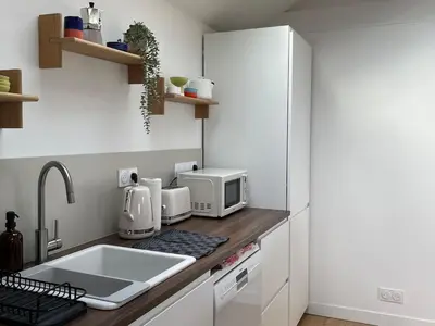 Cuisine ou kitchenette dans l'établissement La Maison Rose - Ciel by Melrose
