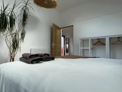 Un ou plusieurs lits dans un hébergement de l'établissement La Maison Rose - Ciel by Melrose