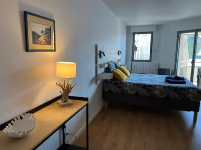 Un ou plusieurs lits dans un hébergement de l'établissement Carteret centre, port avec balcon vue mer