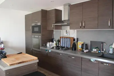 Cuisine ou kitchenette dans l'établissement Les cabines de Granville
