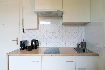 Cuisine ou kitchenette dans l'établissement Joli studio proche tram & université