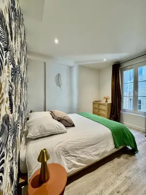 Un ou plusieurs lits dans un hébergement de l'établissement Appartement lumineux avec vue sur les clochers