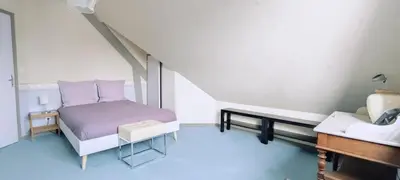 Un ou plusieurs lits dans un hébergement de l'établissement La Villa du Manoir