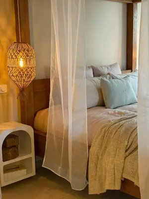Un ou plusieurs lits dans un hébergement de l'établissement Baldamour Cocon romantique et spa Proche Caen