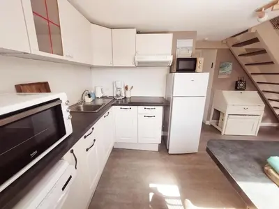 Cuisine ou kitchenette dans l'établissement Cottage dans les dunes
