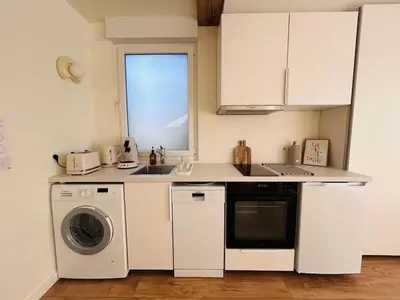 Cuisine ou kitchenette dans l'établissement L échappée