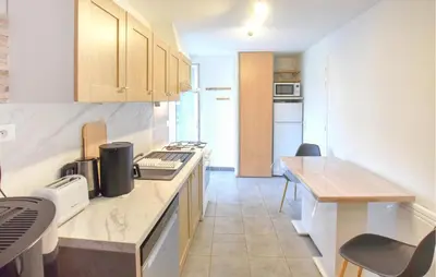Cuisine ou kitchenette dans l'établissement Maison Proche Littoral