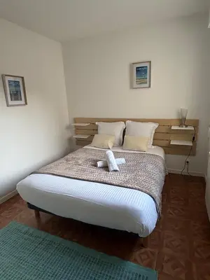 Un ou plusieurs lits dans un hébergement de l'établissement Agréable appartement au cœur de Cabourg