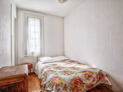 Un ou plusieurs lits dans un hébergement de l'établissement Maison de vacances à 100m de la plage, jardin, séjour convivial - FR-1-788-97