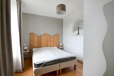 Un ou plusieurs lits dans un hébergement de l'établissement Gîte de la Poste - Avec jardin
