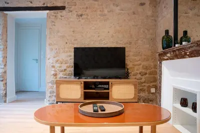 Télévision ou salle de divertissement dans l'établissement Duplex de charme dans le quartier du Vaugueux