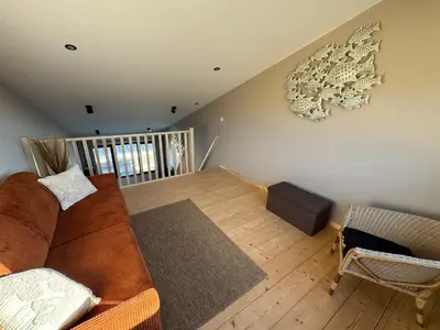 Coin salon dans l'établissement Lodges des Pontons - Cap Ouest - vue mer