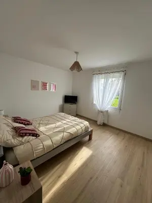 Un ou plusieurs lits dans un hébergement de l'établissement Gîte bord de mer