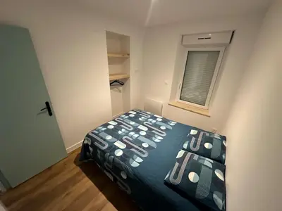 Un ou plusieurs lits dans un hébergement de l'établissement Appartement Granville1