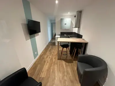 Télévision ou salle de divertissement dans l'établissement Appartement Granville1