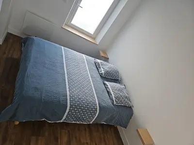Un ou plusieurs lits dans un hébergement de l'établissement Appartement Granville1