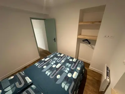 Un ou plusieurs lits dans un hébergement de l'établissement Appartement Granville1