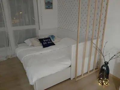 Un ou plusieurs lits dans un hébergement de l'établissement Studio Cosy