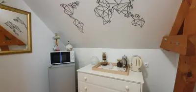 Cuisine ou kitchenette dans l'établissement Maison des Hortensias